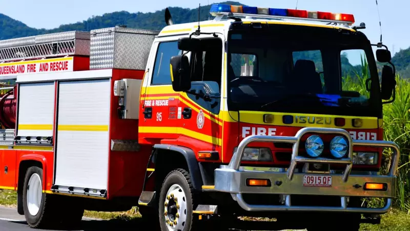 Palm Island Bushfire Emergency: QFES Battles Blaze Behind Farm Road