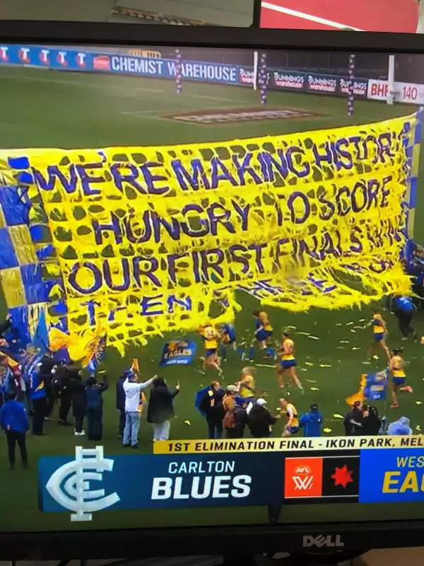 West Coast Eagles' AFLW banner battles brutal Melbourne weather in finals debut