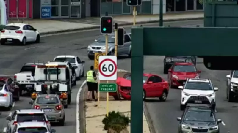 Pre-Peak Hour Chaos on Mill Point Road After Red Sedan Crashes into Traffic Light Pole