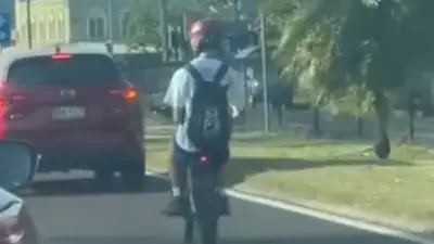 Teen's Illegal E-Bike Stunt in Peak Hour Cairns Traffic Prompts Police Warning