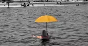 Newcastle Woman's Yellow Umbrella Photo Goes Viral, Capturing Global Attention