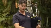 Young Bagpiper's Homecoming: Royal Edinburgh Military Tattoo Debuts in Brisbane