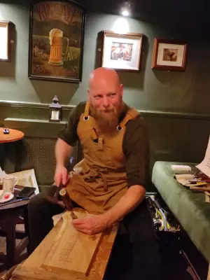 Irish Craftsman Revives Ancient Ogham Script in Trim Pub Demonstrations