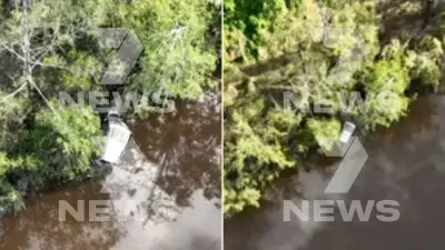 Submerged Vehicle Found in Queensland Floodwaters in Search for Missing Tourists