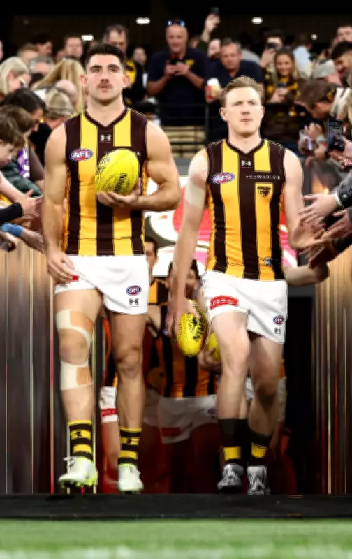 Hawks co-captains firm to face Dockers after light training session