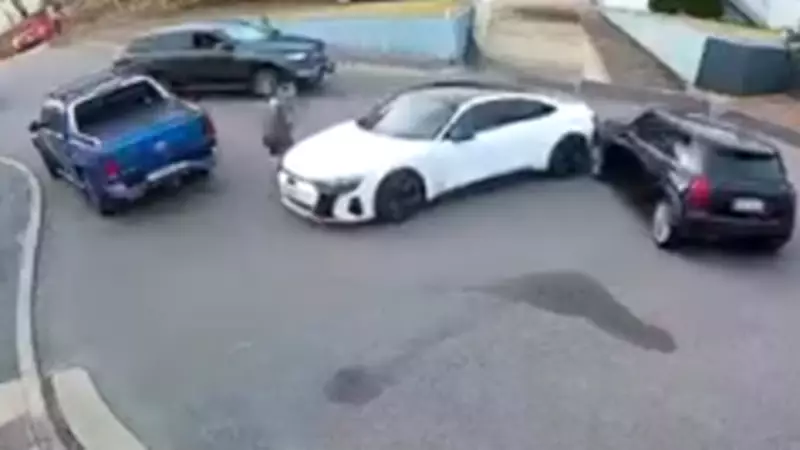 Shocking Footage: Man Leaps to Safety as Stolen SUV Drives at Him