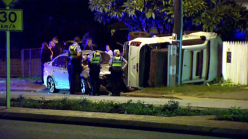 Unoccupied ute crashes into fence and garden after sedan collision in Guildford