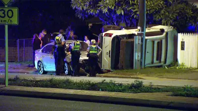Unoccupied ute crashes into fence and garden after sedan collision in Guildford