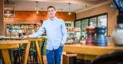 Canberra cafe owner Spiro Tsiros feels budget squeeze, shares struggles