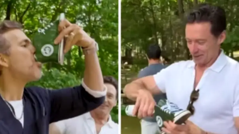 Hugh Jackman teaches Ryan Reynolds Aussie shoey tradition on SailGP set