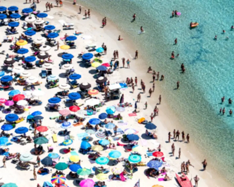 Sardinian Beach Bans Umbrellas for Ages 10-65 to Protect Environment