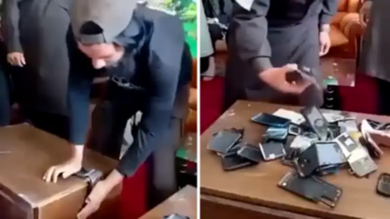 Taliban Bans Smartphones, Officials Seen Destroying Devices
