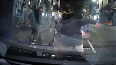 Manhunt for attackers who broke student's jaw in Melbourne CBD