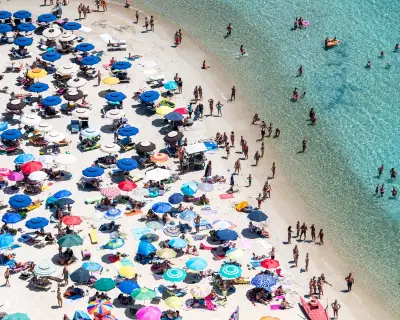 Sardinian Beach Bans Umbrellas for Ages 10-65 to Protect Environment