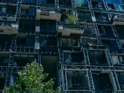Night attack on Kyiv residential complex leaves residents salvaging homes