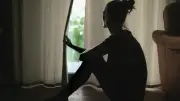 Woman Disturbed by Neighbor Peeping into Her Windows with Child
