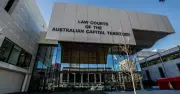 Two arrested after firearms, stun guns, and $10k cash found in Canberra